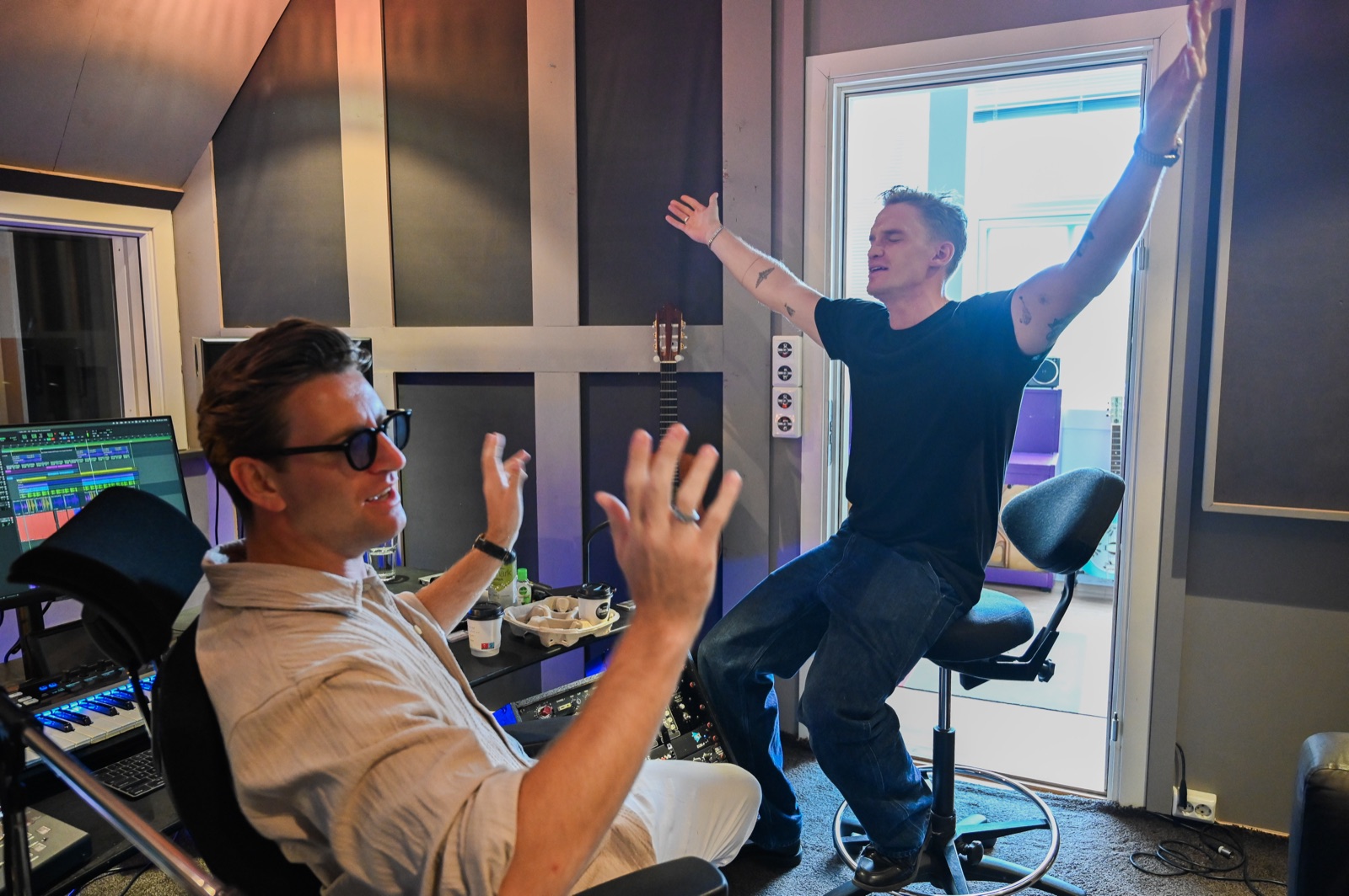 Magnus Murphy and Cody Simpson sharing a creative moment during a studio session
